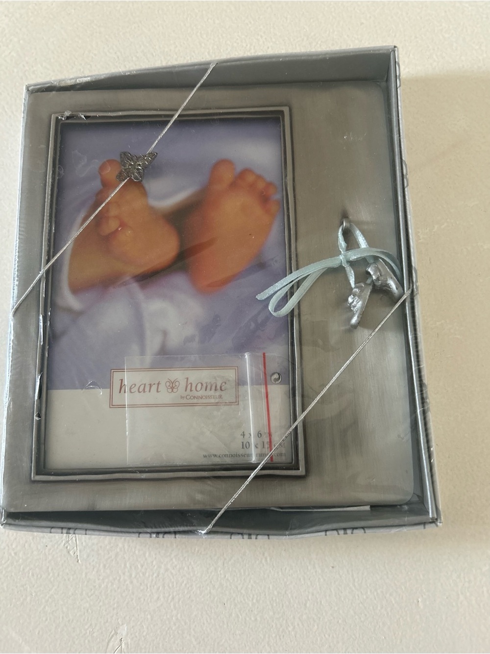 Silver Baby Frame with Blue Ribbon Accent. Perfect keepsake. Hold photo 4x6